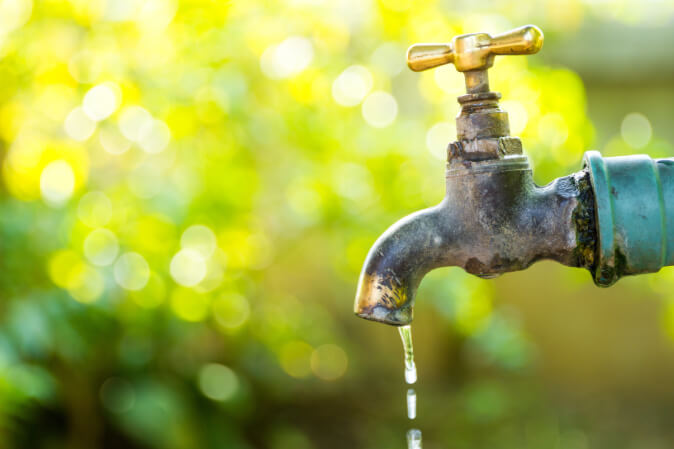 outdoor faucet drips water